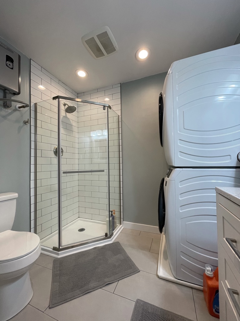 Second bathroom with walk-in shower and washer/dryer